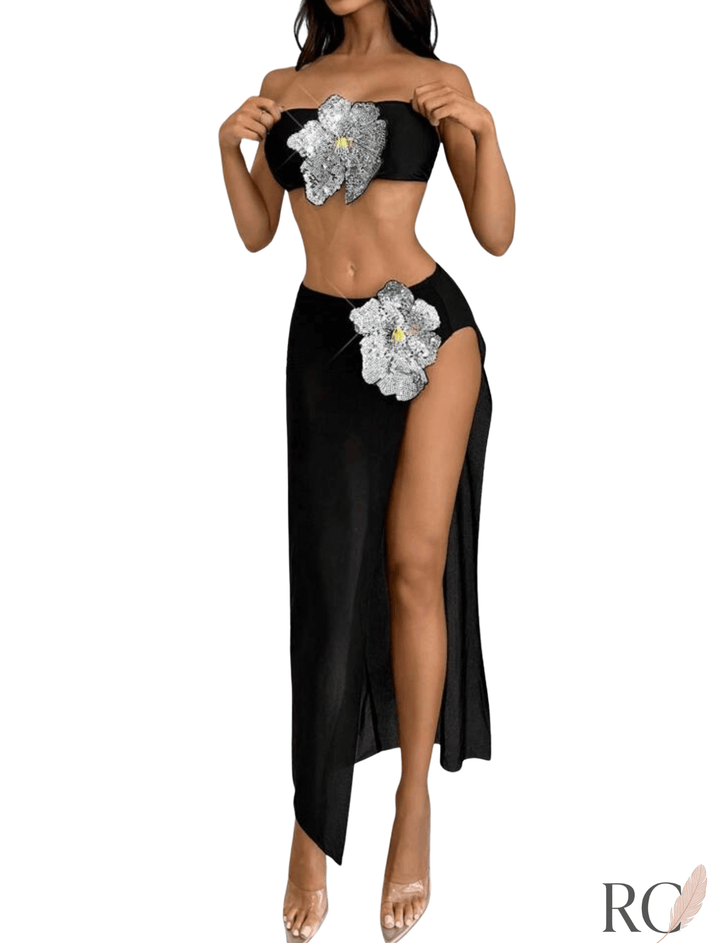 Back-side view of a stunning black 3 piece bikini set, showcasing the strapless top's fit and the elegant high-slit skirt.